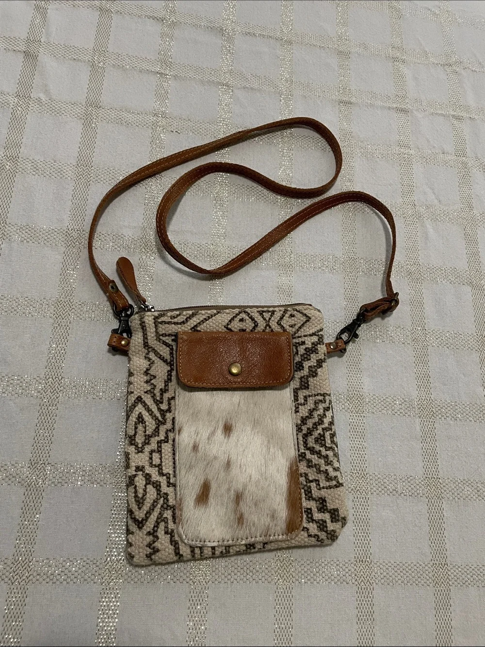 Myra Vuierra crossbody bag, cow print front pocket, plain back, adjustable strap